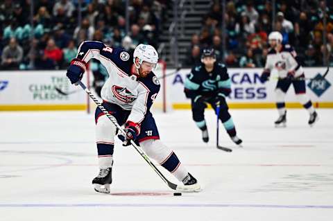 Jan 28, 2023; Seattle, Washington, USA; Columbus Blue Jackets defenseman Vladislav Gavrikov (4) advances the puck against the Seattle Kraken during the third period at Climate Pledge Arena. Seattle defeated Columbus 3-1. Mandatory Credit: Steven Bisig-USA TODAY Sports