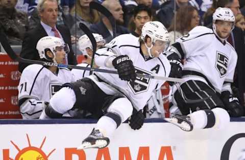 Dec 19, 2015; Toronto, Ontario, CAN; Los Angeles Kings center Anze Kopitar (11) jumps over the boards and onto the ice to begin his shift as does right wing Marian Gaborik (12) against the Toronto Maple Leafs at Air Canada Centre. The Maple Leafs beat the Kings 5-0. Mandatory Credit: Tom Szczerbowski-USA TODAY Sports