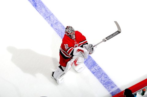 RALEIGH, NC – DECEMBER 16: Cam Ward #30 of the Carolina Hurricanes prepares to leave the ice following pregame warm up prior to an NHL game against the Columbus Blue Jackets during an NHL game on December 16, 2017 at PNC Arena in Raleigh, North Carolina. (Photo by Gregg Forwerck/NHLI via Getty Images)