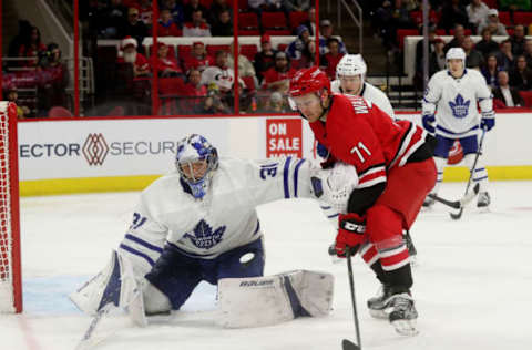 RALEIGH, NC – DECEMBER 11: Lucas Wallmark #71 of the Carolina Hurricanes skates near the crease as Frederik Andersen #31 of the Toronto Maple Leafs extencs his glove hand to interfere near the crease during an NHL game on December 11, 2018 at PNC Arena in Raleigh, North Carolina. (Photo by Gregg Forwerck/NHLI via Getty Images)