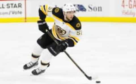 Dec 23, 2016; Raleigh, NC, USA; Boston Bruins forward Ryan Spooner (51) skates with the puck against the Carolina Hurricanes at PNC Arena. The Carolina Hurricanes defeated the Boston Bruins 3-2 in overtime. Mandatory Credit: James Guillory-USA TODAY Sports