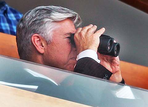 BOSTON – SEPTEMBER 26: Boston Red Sox president of baseball operations Dave Dombrowski looks through a set of binoculars from his suite during the top of the third inning. The Boston Red Sox host the Baltimore Orioles in the first of two regular season MLB baseball games in a doubleheader at Fenway Park in Boston on Sep. 26, 2018. (Photo by Jim Davis/The Boston Globe via Getty Images)