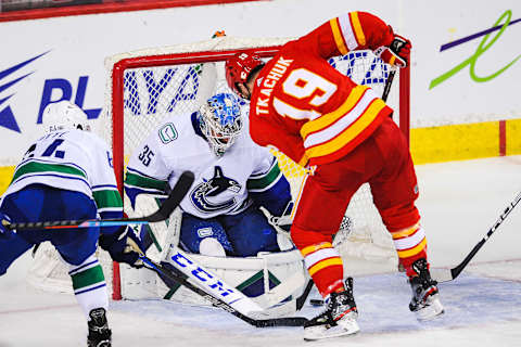 CALGARY, AB – JANUARY 18: Matthew Tkachuk #19 of the Calgary Flames takes a shot on Thatcher Demko #35 of the Vancouver Canucks. (Photo by Derek Leung/Getty Images)