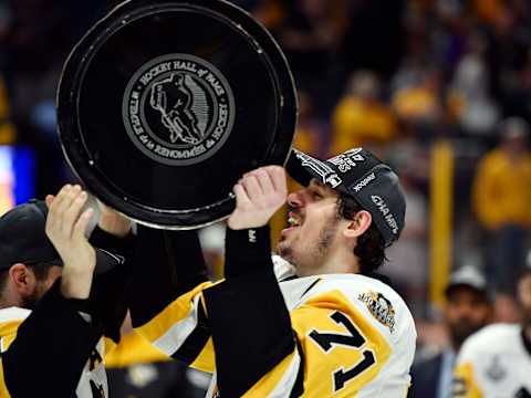 Jun 11, 2017; Nashville, TN, USA; Pittsburgh Penguins center Evgeni Malkin (71) hoists the Stanley Cup after defeating the Nashville Predators in game six of the 2017 Stanley Cup Final at Bridgestone Arena. Mandatory Credit: Christopher Hanewinckel-USA TODAY Sports