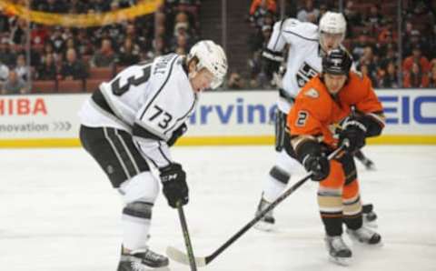 January 17, 2016; Anaheim, CA, USA; Los Angeles Kings center Tyler Toffoli (73) moves the puck against Anaheim Ducks defenseman Kevin Bieksa (2) during the first period at Honda Center. Mandatory Credit: Gary A. Vasquez-USA TODAY Sports