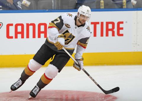 Shea Theodore with the Puck. (Photo by Claus Andersen/Getty Images)