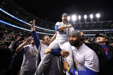 CLEVELAND, OH – NOVEMBER 02: Anthony Rizzo #44, David Ross #3 and Jason Heyward #22 of the Chicago Cubs celebrate with actor John Cusack (R) after defeating the Cleveland Indians 8-7 in Game Seven of the 2016 World Series at Progressive Field on November 2, 2016 in Cleveland, Ohio. The Cubs win their first World Series in 108 years. (Photo by Ezra Shaw/Getty Images)