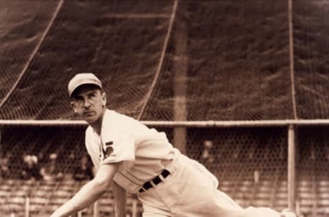 American baseball player and left-handed screwball pitcher Carl Owen Hubbell (1903 – 1988) of the New York Giants tosses out a pitch in the Polo Grounds Stadium, New York, New York, 1938. (Photo by FPG/Getty Images)