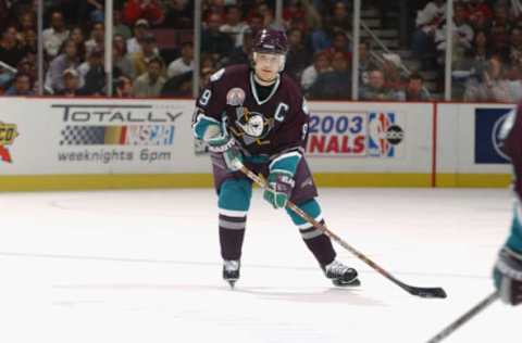 EAST RUTHERFORD, NJ: Paul Kariya #9 of the Mighty Ducks of Anaheim looks to pass against the New Jersey Devils in game seven of the 2003 Stanley Cup Finals on June 9, 2003. (Photo by Dave Sandford/Getty Images/NHLI)