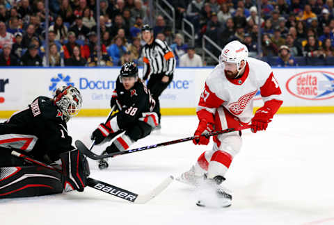 Dec 29, 2022; Buffalo, New York, USA; Buffalo Sabres goaltender Ukko-Pekka Luukkonen (1) makes a save on Detroit Red Wings defenseman Filip Hronek (17) during the first period at KeyBank Center. Mandatory Credit: Timothy T. Ludwig-USA TODAY Sports