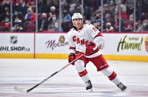 MONTREAL, QC – OCTOBER 21: Ethan Bear #25 of the Carolina Hurricanes skates against the Montreal Canadiens during the first period at Centre Bell on October 21, 2021, in Montreal, Canada. The Carolina Hurricanes defeated the Montreal Canadiens 4-1. (Photo by Minas Panagiotakis/Getty Images)