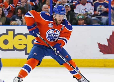 Edmonton Oilers forward Taylor Hall (4) takes the puck to the net. Mandatory Credit: Perry Nelson-USA TODAY Sports