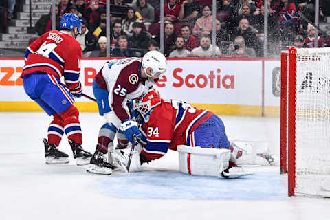 MONTREAL, CANADA – MARCH 13: Logan O’Connor #25 of the Colorado Avalanche skates into goaltender Jake Allen #34 of the Montreal Canadiens during the first period at Centre Bell on March 13, 2023 in Montreal, Quebec, Canada. (Photo by Minas Panagiotakis/Getty Images)