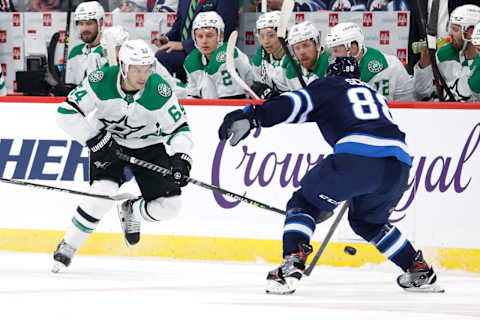 Dallas Stars, Tanner Kero (64); Winnipeg Jets, Nate Schmidt (88). Mandatory Credit: James Carey Lauder-USA TODAY Sports