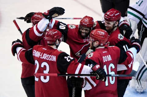 NHL Team Name Origins: Arizona Coyotes center Martin Hanzal (11) celebrates with left wing Anthony Duclair (10), defenseman Oliver Ekman-Larsson (23) and center Max Domi (16) after scoring a goal in the third period against the Dallas Stars at Gila River Arena. Mandatory Credit: Matt Kartozian-USA TODAY Sports