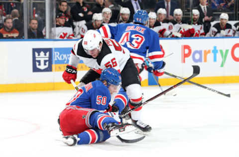 NEW YORK, NY – MARCH 09: Lias Andersson #50 of the New York Rangers battles for the puck against Blake Pietila #56 of the New Jersey Devils at Madison Square Garden on March 9, 2019 in New York City. (Photo by Jared Silber/NHLI via Getty Images)