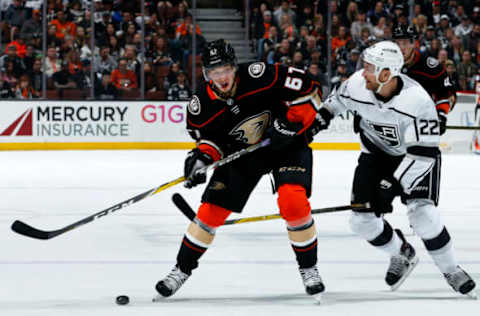 ANAHEIM, CA: Rickard Rakell #67 of the Anaheim Ducks battles for the puck against Trevor Lewis #22 of the Los Angeles Kings during the game on March 30, 2018. (Photo by Debora Robinson/NHLI via Getty Images)