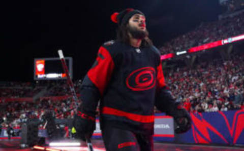 Feb 18, 2023; Raleigh, North Carolina, USA; Carolina Hurricanes defenseman Jalen Chatfield (5) leaves the ice after the warmups against the Washington Capitals during the 2023 Stadium Series ice hockey game at Carter-Finley Stadium. Mandatory Credit: James Guillory-USA TODAY Sports