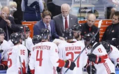 Sep 20, 2016; Toronto, Ontario, Canada; Team Canada head coach Mike Babcock (left) and assistant coach Joel Quenneville (right) address the players during a break in the action against Team USA of preliminary round play in the 2016 World Cup of Hockey at Air Canada Centre. Team Canada defeated Team USA 4-2. Mandatory Credit: John E. Sokolowski-USA TODAY Sports