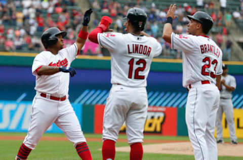 CLEVELAND, OH – JUNE 20: Jose Ramirez #11 of the Cleveland Indians celebrates with Francisco Lindor #12 and Michael Brantley #23 after hitting a three run home run off Reynaldo Lopez #40 of the Chicago White Sox during the first inning at Progressive Field on June 20, 2018 in Cleveland, Ohio. The Indians defeated the White Sox 12-0. (Photo by Ron Schwane/Getty Images)