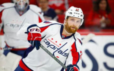 Dec 16, 2016; Raleigh, NC, USA; Washington Capitals defensemen Karl Alzner (27) passes the puck before the game against the Carolina Hurricanes at PNC Arena. The Washington Capitals defeated the Carolina Hurricanes 4-3 in the shoot out. Mandatory Credit: James Guillory-USA TODAY Sports