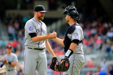 ATLANTA, GA – AUGUST 19: Wade Davis #71 of the Colorado Rockies celebrates beating the Atlanta Braves with Tony Wolters #14 at SunTrust Park on August 19, 2018 in Atlanta, Georgia. (Photo by Daniel Shirey/Getty Images)