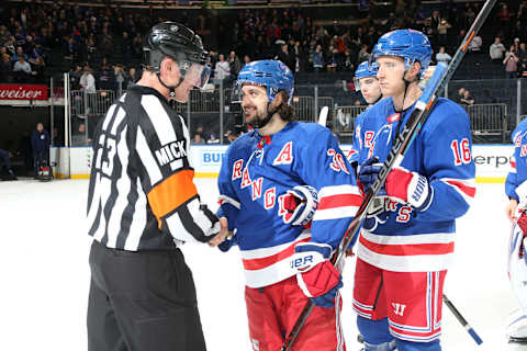 NEW YORK, NY – JANUARY 15: Referee Brad Watson shakes hands with Mats Zuccarello #36 of the New York Rangers after working his final game at Madison Square Garden following the game against the Carolina Hurricanes on January 15, 2019 in New York City. The New York Rangers won 6-2. (Photo by Jared Silber/NHLI via Getty Images)