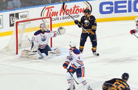 BUFFALO, NY – DECEMBER 06: Rasmus Ristolainen #55 of the Buffalo Sabres scores the game-winning overtime goal with a screen from Kyle Okposo #21 against Cam Talbot #33 of the Edmonton Oilers during an NHL game at the KeyBank Center on December 6, 2016 in Buffalo, New York. Buffalo won, 4-3. (Photo by Bill Wippert/NHLI via Getty Images)