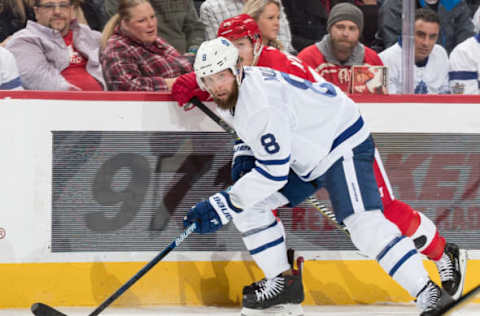 DETROIT, MI – FEBRUARY 01: Jake Muzzin #8 of the Toronto Maple Leafs skates up ice looking for the puck in front of Gustav Nyquist #14 of the Detroit Red Wings during an NHL game at Little Caesars Arena on February 1, 2019 in Detroit, Michigan. (Photo by Dave Reginek/NHLI via Getty Images)