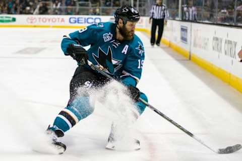 Jan 26, 2016; San Jose, CA, USA; San Jose Sharks center Joe Thornton (19) gets control of the puck in the game against the Colorado Avalanche in the 2nd period at SAP Center at San Jose. Mandatory Credit: John Hefti-USA TODAY Sports. The Sharks won 6-1.