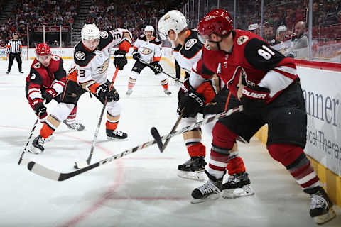 GLENDALE, ARIZONA – NOVEMBER 27: Jakob Silfverberg #33 of the Anaheim Ducks controls the puck pressured by Nick Schmaltz #8 and Phil Kessel #81 of the Arizona Coyotes during the third period of the NHL game at Gila River Arena on November 27, 2019 in Glendale, Arizona. The Coyotes defeated the Ducks 4-3 in an overtime shootout. (Photo by Christian Petersen/Getty Images)