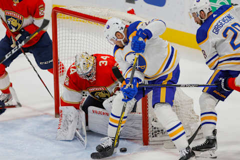 Apr 4, 2023; Sunrise, Florida, USA; Florida Panthers goaltender Alex Lyon (34) defends his net from Buffalo Sabres right wing Kyle Okposo (21) during the third period at FLA Live Arena. Mandatory Credit: Sam Navarro-USA TODAY Sports