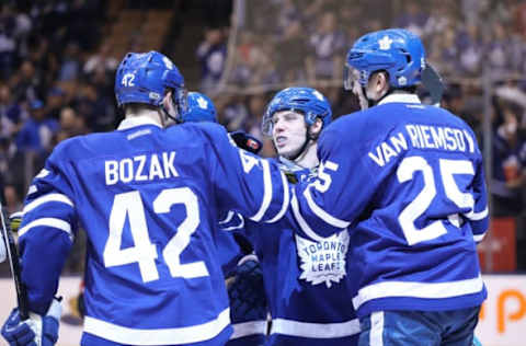 Apr 9, 2017; Toronto, Ontario, CAN; Toronto Maple Leafs left wing James van Riemsdyk (25) celebrates his goal with center Mitch Marner (16) and center Tyler Bozak (42) in the second period against the Columbus Blue Jackets at Air Canada Centre. Mandatory Credit: Tom Szczerbowski-USA TODAY Sports