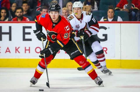 Oct 5, 2016; Calgary, Alberta, CAN; Calgary Flames center Sam Bennett (93) controls the puck against Arizona Coyotes during the first period during a preseason hockey game at Scotiabank Saddledome. Mandatory Credit: Sergei Belski-USA TODAY Sports