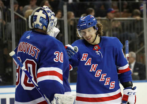 NEW YORK, NEW YORK – NOVEMBER 27: Henrik Lundqvist #30 and Artemi Panarin #10 of the New York Rangers celebrate their victory