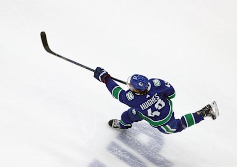 Quinn Hughes #43 of the Vancouver Canucks takes the shot  (Photo by Bruce Bennett/Getty Images)