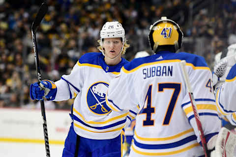 PITTSBURGH, PENNSYLVANIA – DECEMBER 17: Rasmus Dahlin #26 of the Buffalo Sabres celebrates his goal with Malcolm Subban #47 during the third period of a game against the Pittsburgh Penguins at PPG PAINTS Arena on December 17, 2021 in Pittsburgh, Pennsylvania. (Photo by Emilee Chinn/Getty Images)