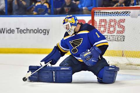 Apr 25, 2016; St. Louis, MO, USA; St. Louis Blues goalie Brian Elliott (1) blocks a shot against the Chicago Blackhawks during the first period in game seven of the first round of the 2016 Stanley Cup Playoffs at Scottrade Center. Mandatory Credit: Jasen Vinlove-USA TODAY Sports