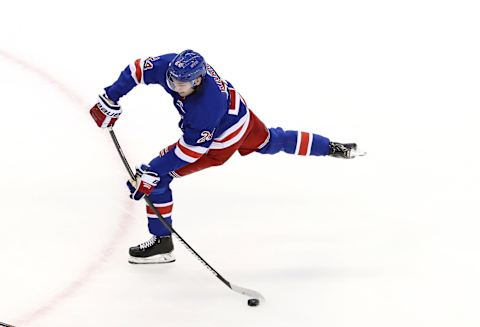 Kaapo Kakko #24 of the New York Rangers takes a shot in the first period against the New York Islanders during an exhibition game. (Photo by Andre Ringuette/Freestyle Photo/Getty Images)