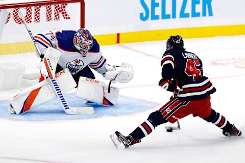 Winnipeg Jets, Brad Lambert (47) Edmonton Oilers, Stuart Skinner (74). Mandatory Credit: James Carey Lauder-USA TODAY Sports