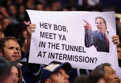 Apr 15, 2015; Vancouver, British Columbia, CAN; Vancouver Canucks fans hold up a sign with former coach John Tortorella during the first period as the Vancouver Canucks host the Calgary Flames in game one of the first round of the the 2015 Stanley Cup Playoffs at Rogers Arena. Mandatory Credit: Anne-Marie Sorvin-USA TODAY Sports