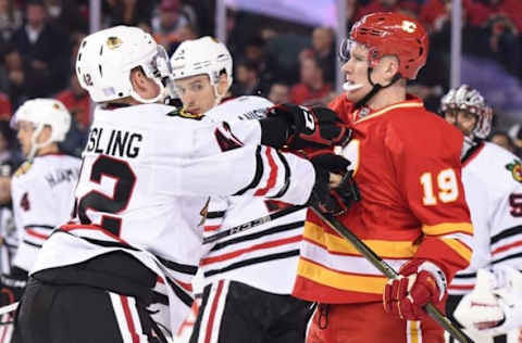 Nov 18, 2016; Calgary, Alberta, CAN; Calgary Flames left wing Matthew Tkachuk (19) tangles with Chicago Blackhawks defenseman Gustav Forsling (42) during the first period at Scotiabank Saddledome. Mandatory Credit: Candice Ward-USA TODAY Sports