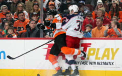 PHILADELPHIA, PA – MARCH 15: Scott Laughton #21 of the Philadelphia Flyers battles for the puck along the boards against Boone Jenner #38 of the Columbus Blue Jackets on March 15, 2018 at the Wells Fargo Center in Philadelphia, Pennsylvania. (Photo by Len Redkoles/NHLI via Getty Images)