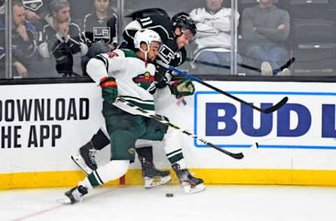 LOS ANGELES, CA – NOVEMBER 12: Anze Kopitar (11) of the Los Angeles Kings takes a hit from Jordan Greenway (18) of the Minnesota Wild during the third period of their game on November 12, 2019, at Staples Center in Los Angeles, CA. (Photo by Rob Curtis/Icon Sportswire via Getty Images)