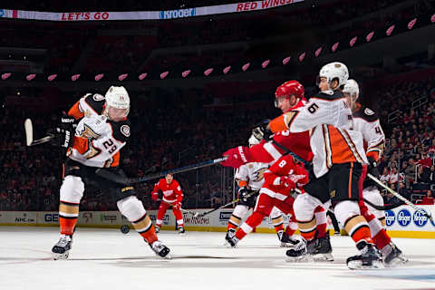 DETROIT, MI – JANUARY 15: Devin Shore #29 of the Anaheim Ducks looks to shoot the puck as teammate Brandon Montour #26 battles with Christoffer Ehn #70 of the Detroit Red Wings during an NHL game at Little Caesars Arena on January 15, 2019 in Detroit, Michigan. Detroit defeated Anaheim 3-1. (Photo by Dave Reginek/NHLI via Getty Images)