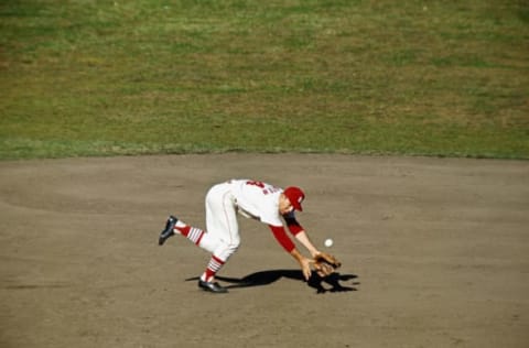 ST. LOUIS – OCTOBER 1964: Ken Boyer #14 of the St. Louis Cardinals dives for a hard hit grounder during the 1964 World Series against the New York Yankees at Busch Stadium in St. Louis, Missouri. (Photo by Focus On Sport/Getty Images)