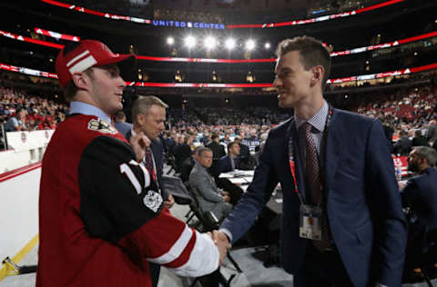 CHICAGO, IL – JUNE 24: Michael Karow meets general manager John Chayka after being selected 126th overall by the Arizona Coyotes during the 2017 NHL Draft at United Center on June 24, 2017 in Chicago, Illinois. (Photo by Dave Sandford/NHLI via Getty Images)