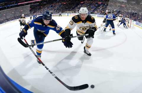 ST. LOUIS, MO: Ivan Barbashev #49 of the St. Louis Blues and Riley Nash #20 of the Boston Bruins battle for the puck at Scottrade Center on March 21, 2018. (Photo by Scott Rovak/NHLI via Getty Images)