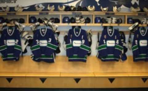 VANCOUVER – DECEMBER 4: Vancouver Canucks jerseys are hung in the locker room before the NHL game against the Boston Bruins at General Motors Place on December 4, 2005 in Vancouver, Canada. The Canucks defeated the Bruins 5-2. (Photo by Jeff Vinnick/Getty Images)