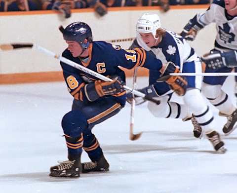 TORONTO, ON – SEPTEMBER 30: Danny Gare #18 of the Buffalo Sabres skates against Pat Hickey #16 of the Toronto Maple Leafs during NHL preseason game action on September 30, 1980 at Maple Leaf Gardens in Toronto, Ontario, Canada. (Photo by Graig Abel/Getty Images)